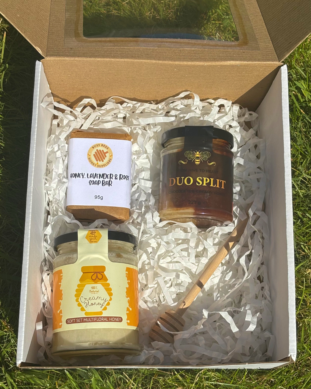 An example image of our Honey Lovers Gift Box with 2 jars of local honey, a soothing honey, lavender and rose soap bar and a honey dipper