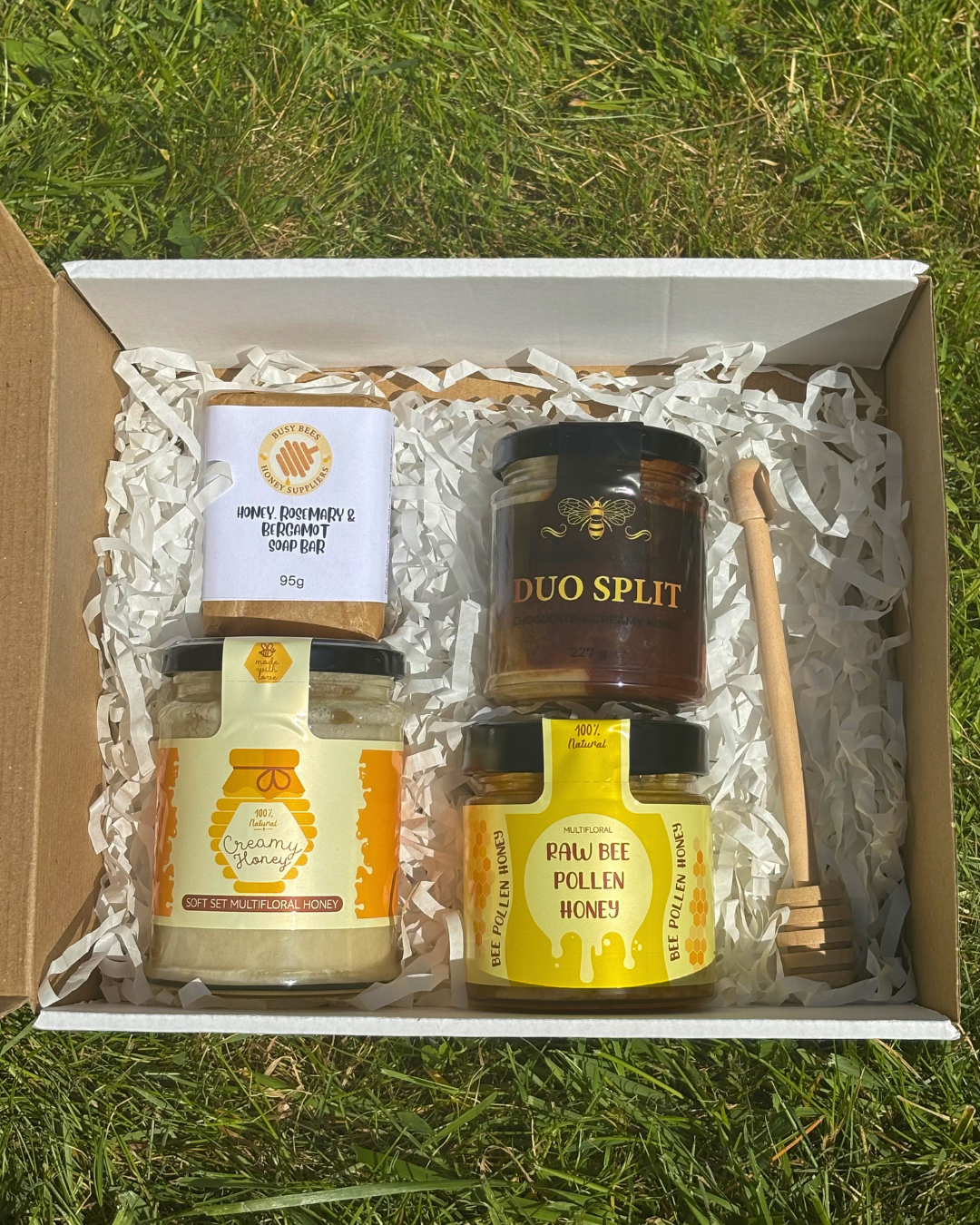 An example image of our Honey Lovers Gift Box with 3 jars of local honey, a soothing honey, rosemary and bergamot soap bar and a honey dipper